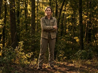 Why are Taurus so stubborn and controlling — composed person with arms crossed and a firm, unmovable expression standing their ground in dramatic natural light